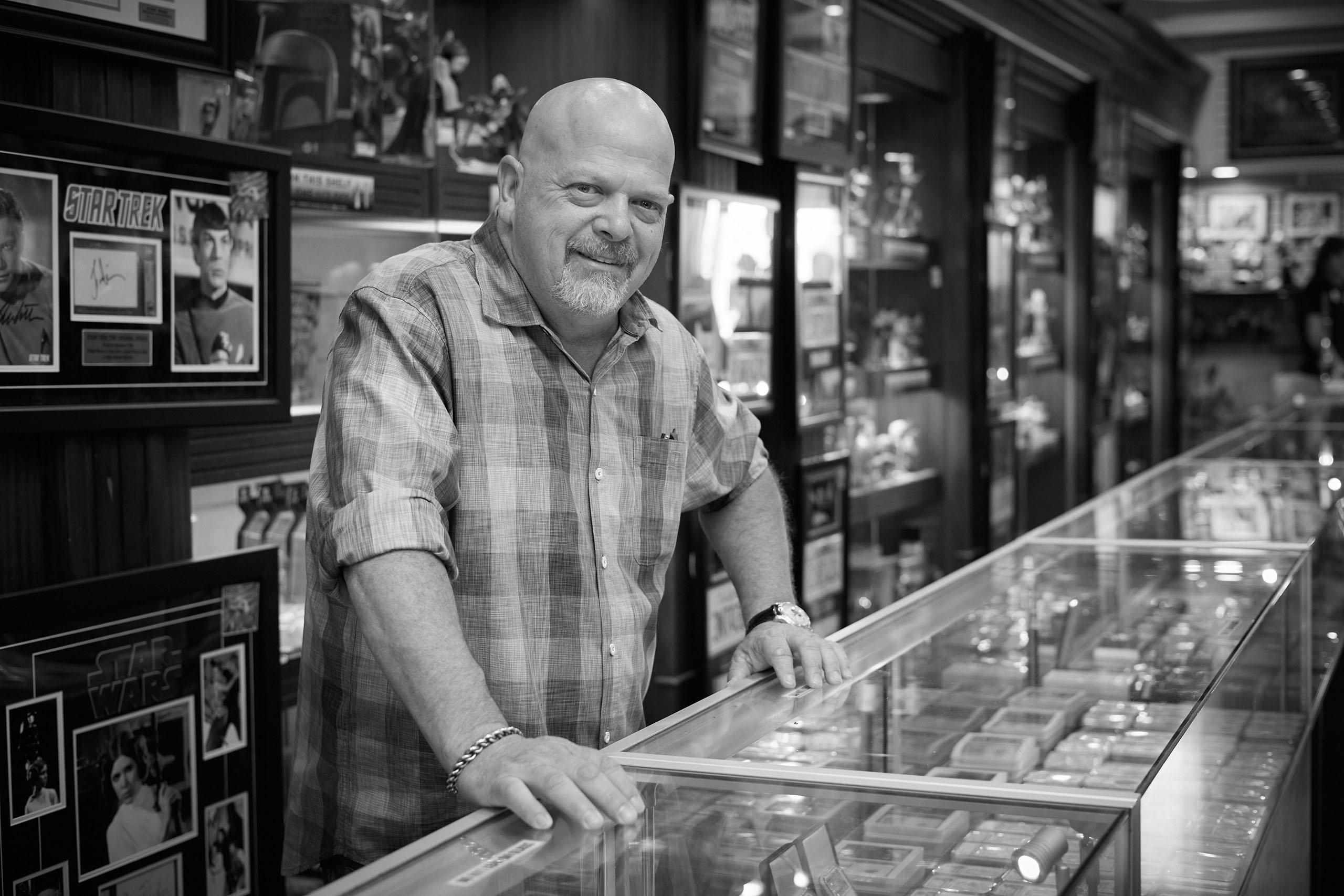 Portrait of Rick Harrison at Gold & Silver Pawn Shop counter.